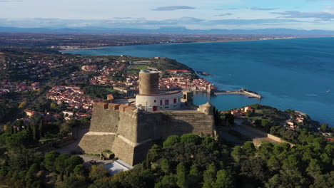 Aerial-parallax-view-of-Collioure-and-Fort-Saint-Elme-France-sunny-day